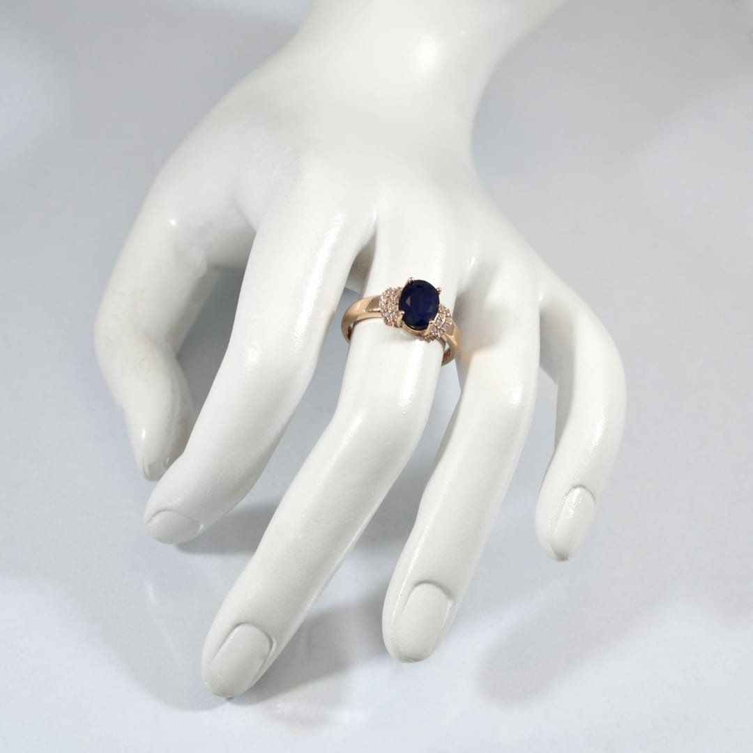 Rose gold ring with sapphire and cubic zirconia