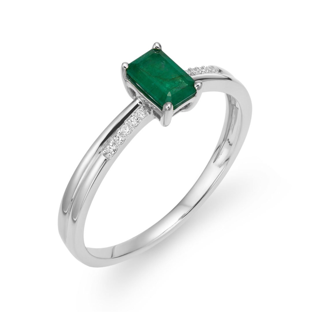 white gold ring with diamonds and emerald