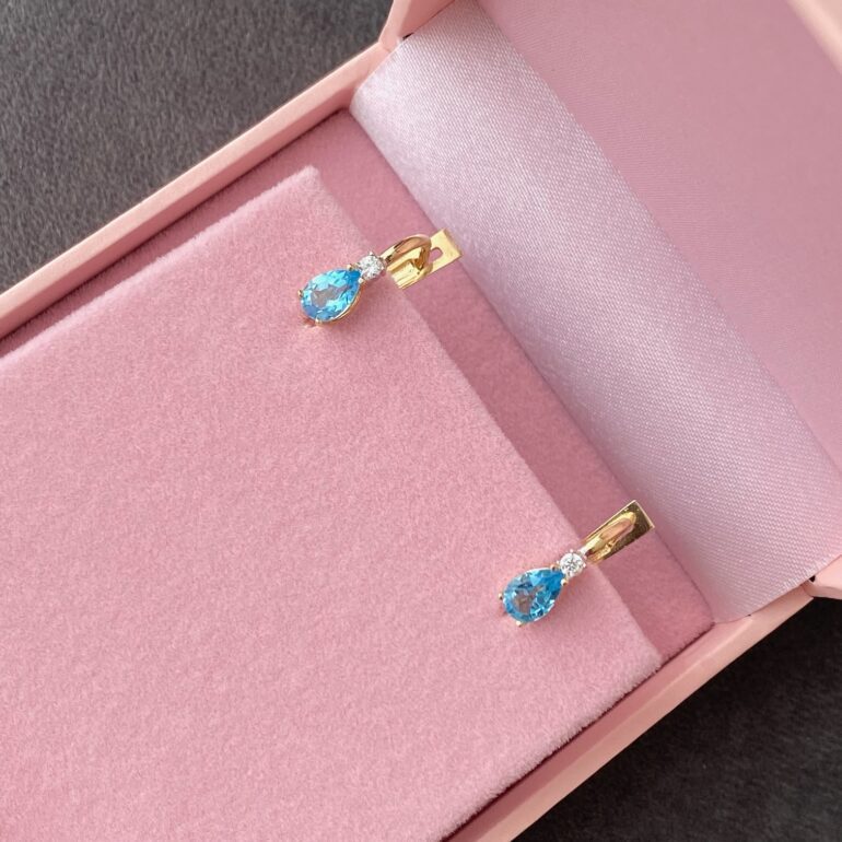 yellow gold earrings with topaz