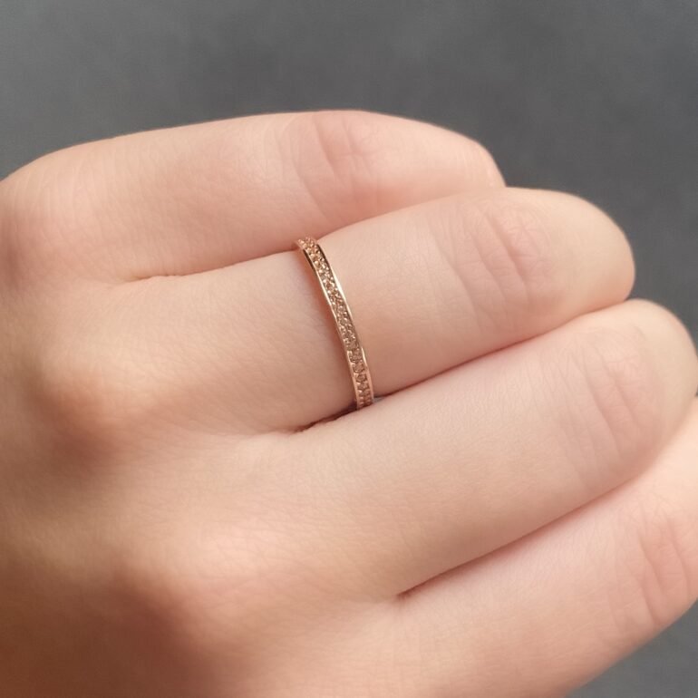 Rose gold eternity ring with champagne cubic zirconia
