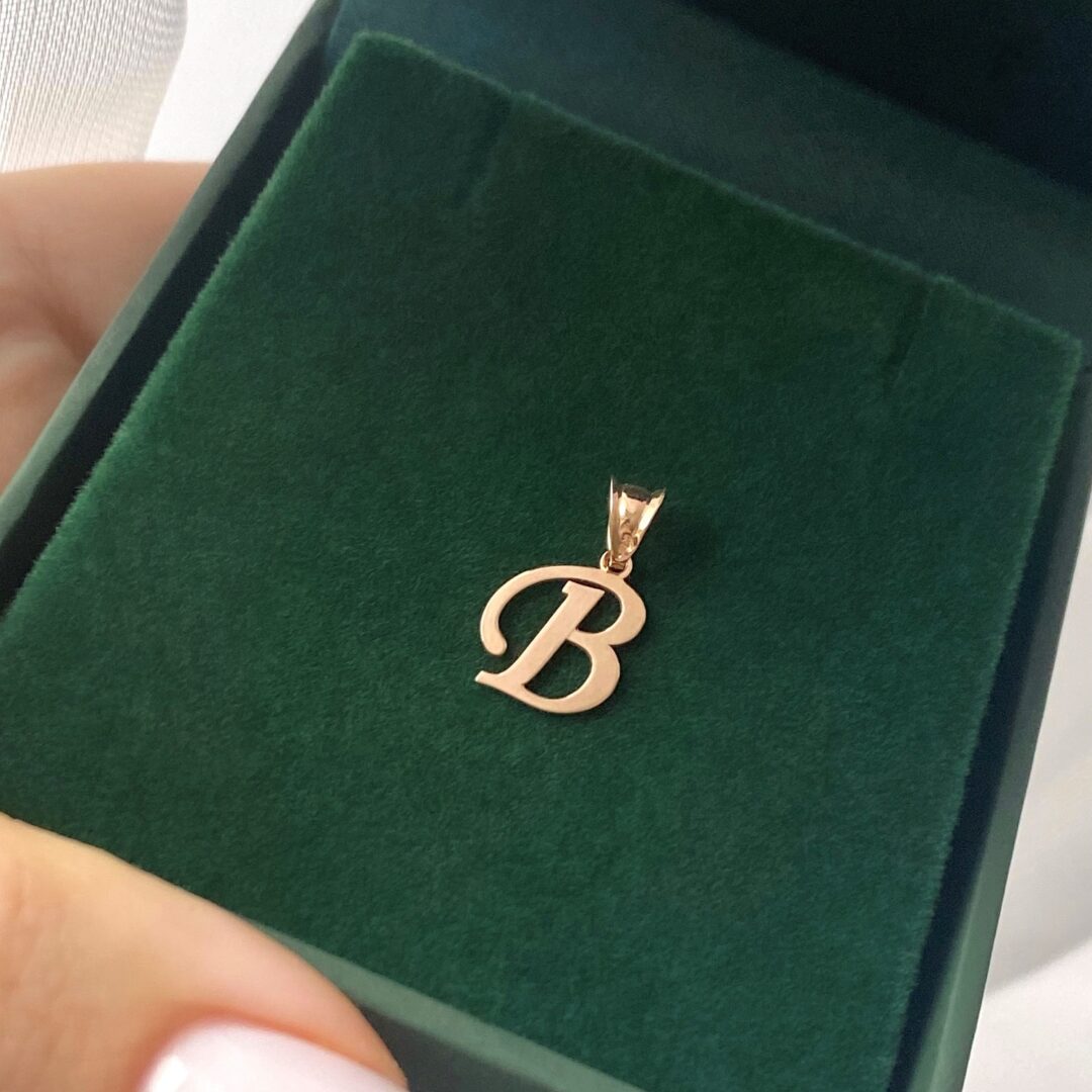 A 14ct rose gold pendant in a shape of initial B