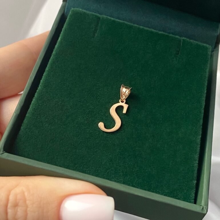 A 14ct rose gold pendant in a shape of initial S