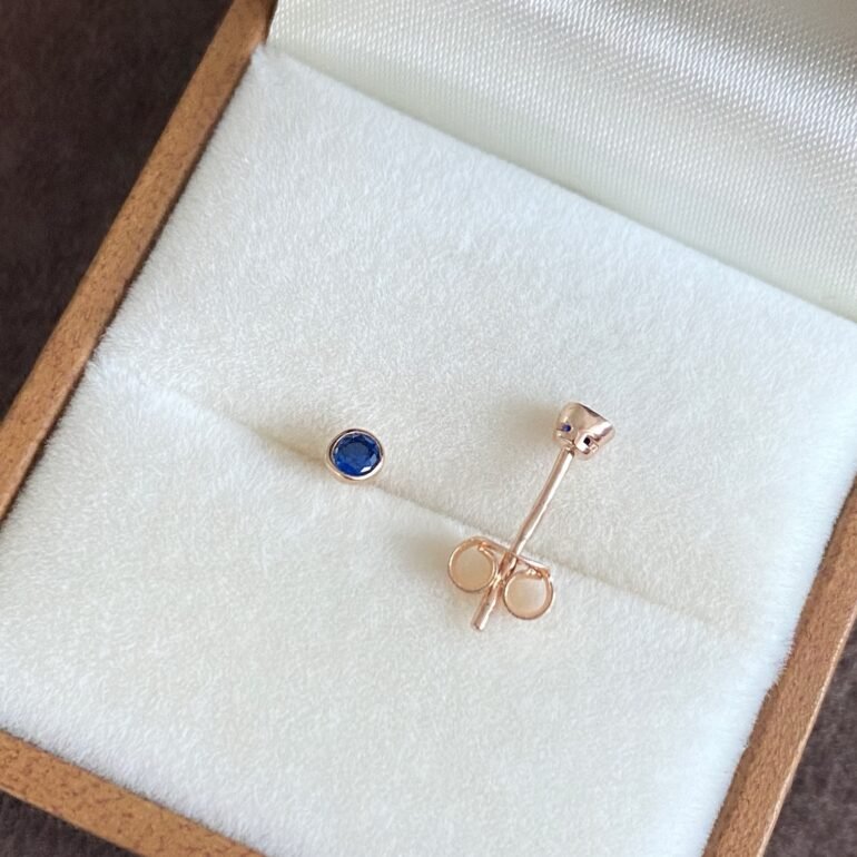 rose gold stud earrings with blue cubic zirconia