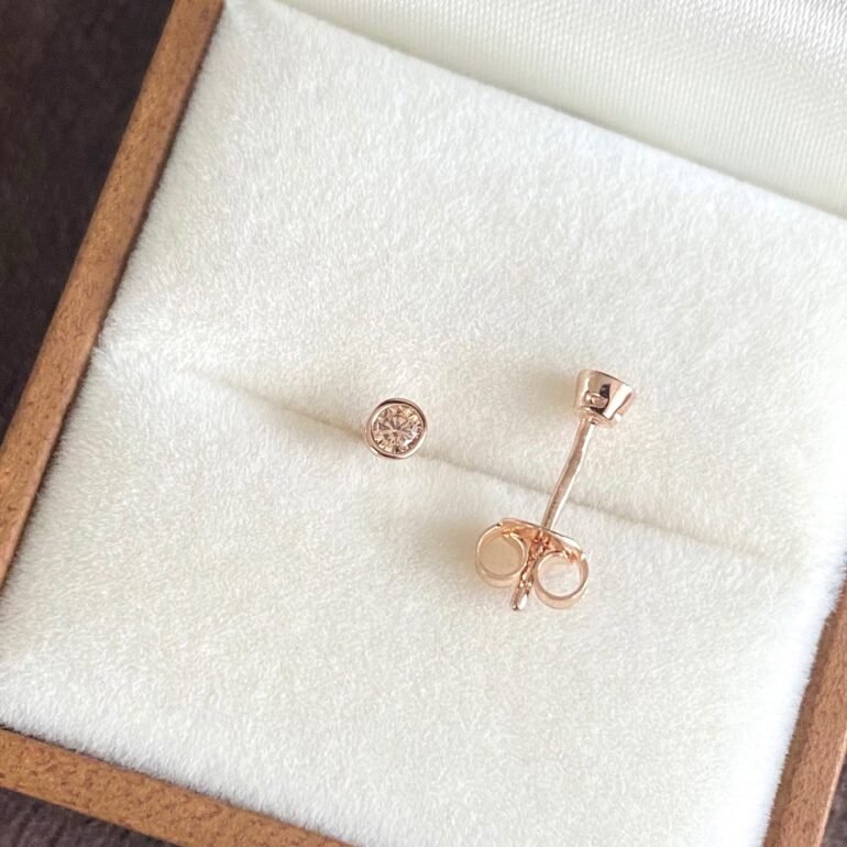 rose gold stud earrings with champagne cubic zirconia