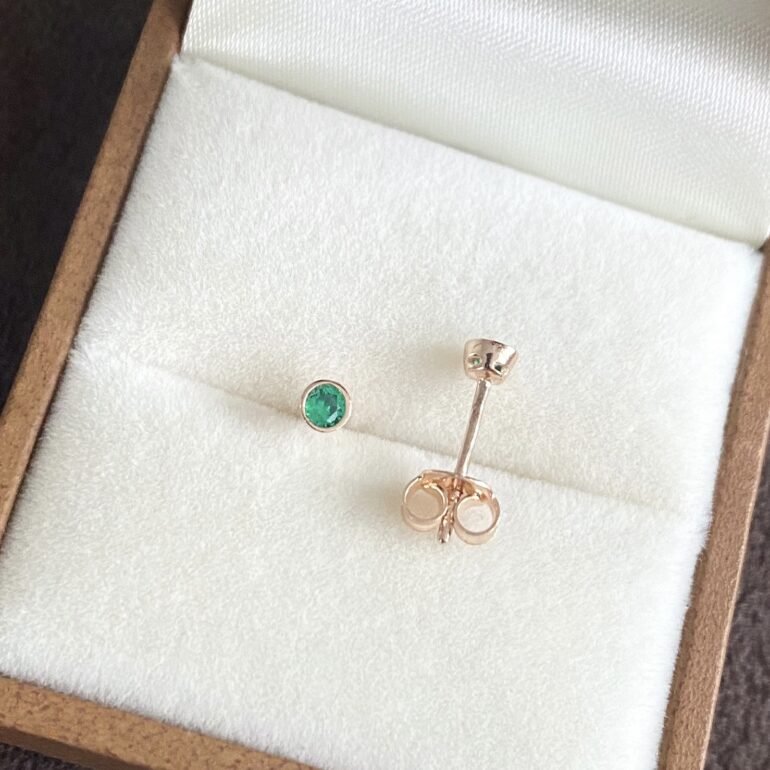 rose gold stud earrings with green cubic zirconia
