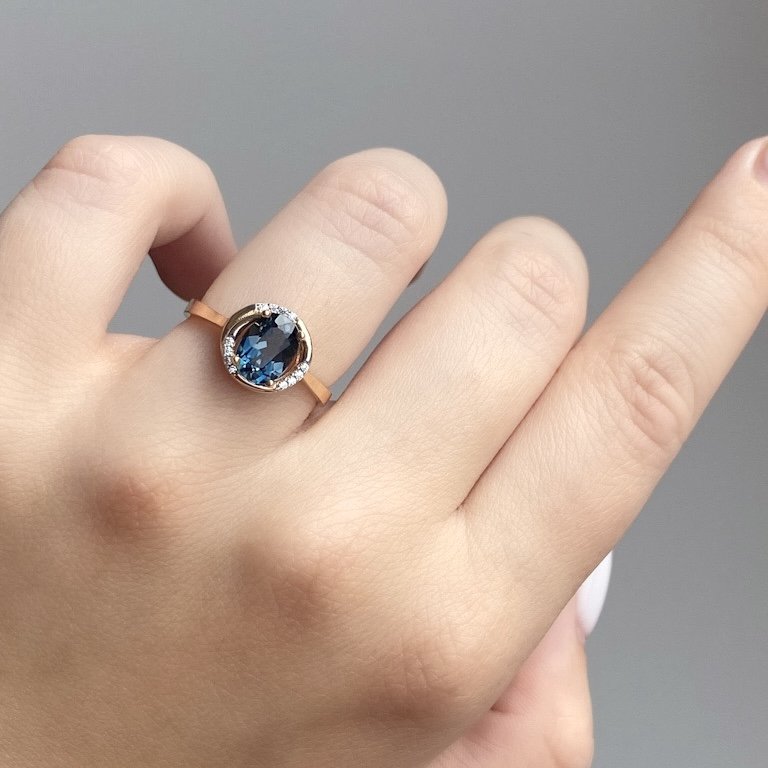 Rose gold ring with London blue topaz and cubic zirconia