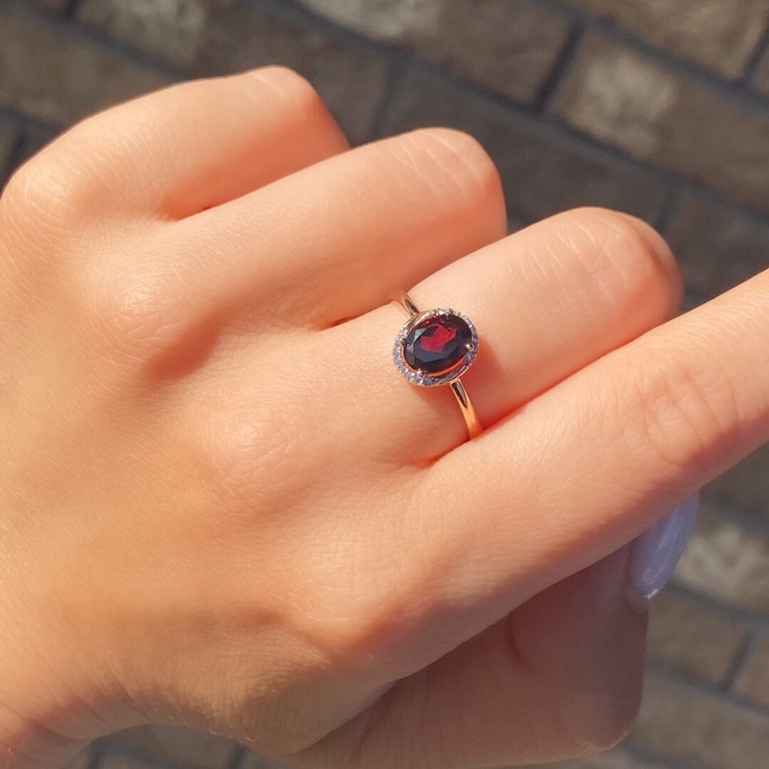 rose gold ring with garnet and cubic zirconia