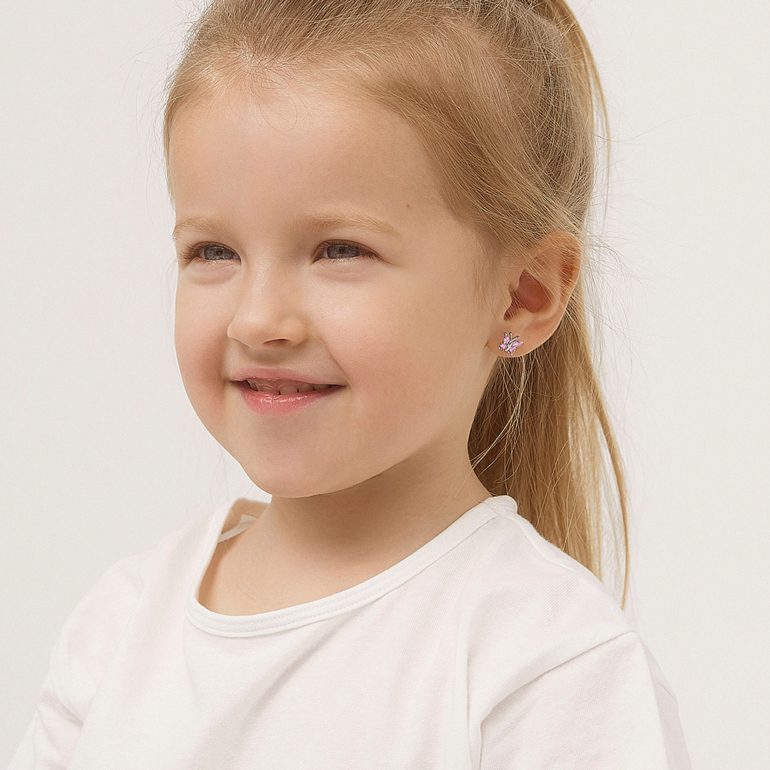 A pair of dainty sterling silver stud earrings with pink cubic zirconia