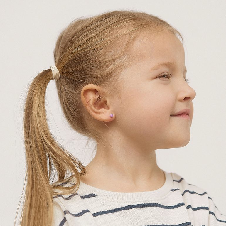 A pair of dainty sterling silver stud earrings for kids