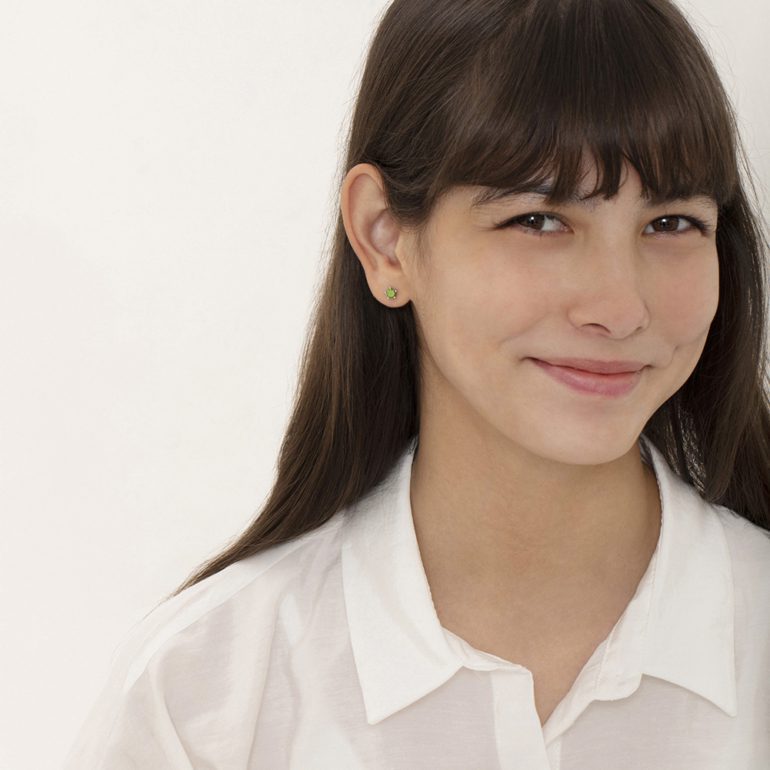 A pair of sterling silver stud kids earrings with cubic zirconia