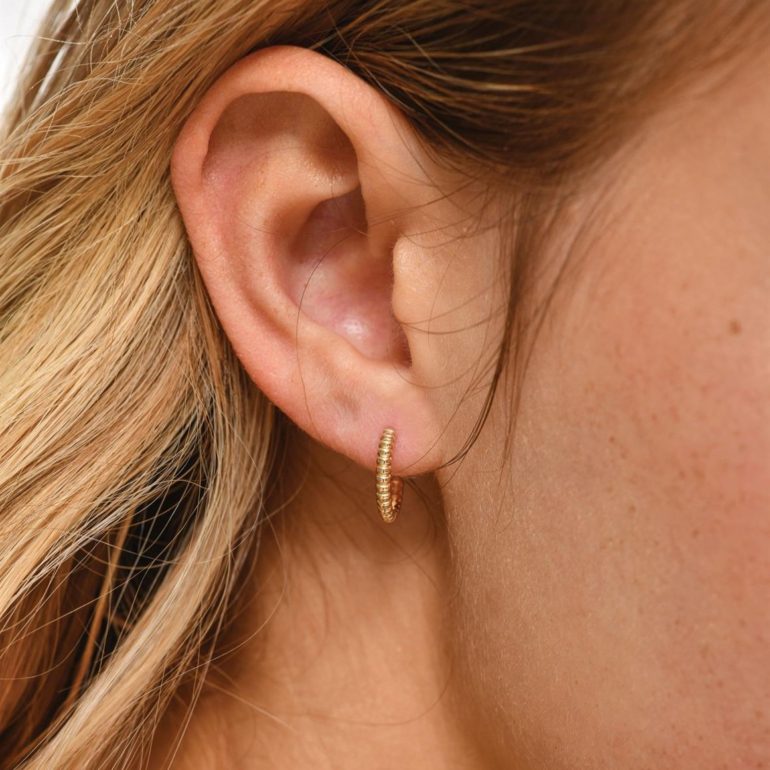 A minimalist rose gold stud earrings