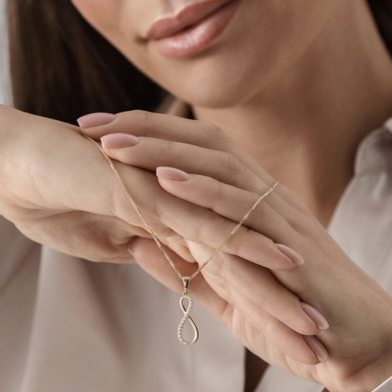 Rose gold infinity pendant with cubic zirconia