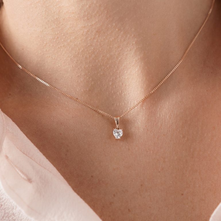 A dainty rose gold heart pendant with cubic zirconia