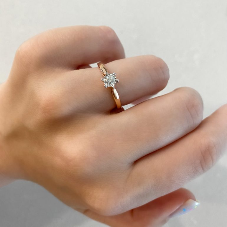 A luxurious 14ct rose gold engagement ring with diamond