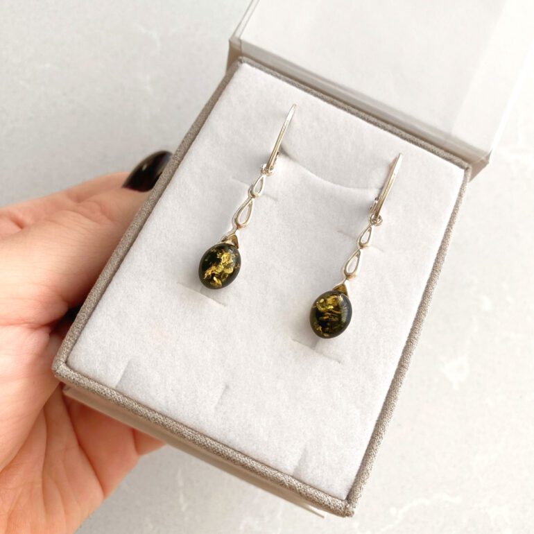 Sterling silver dandling earrings with green amber