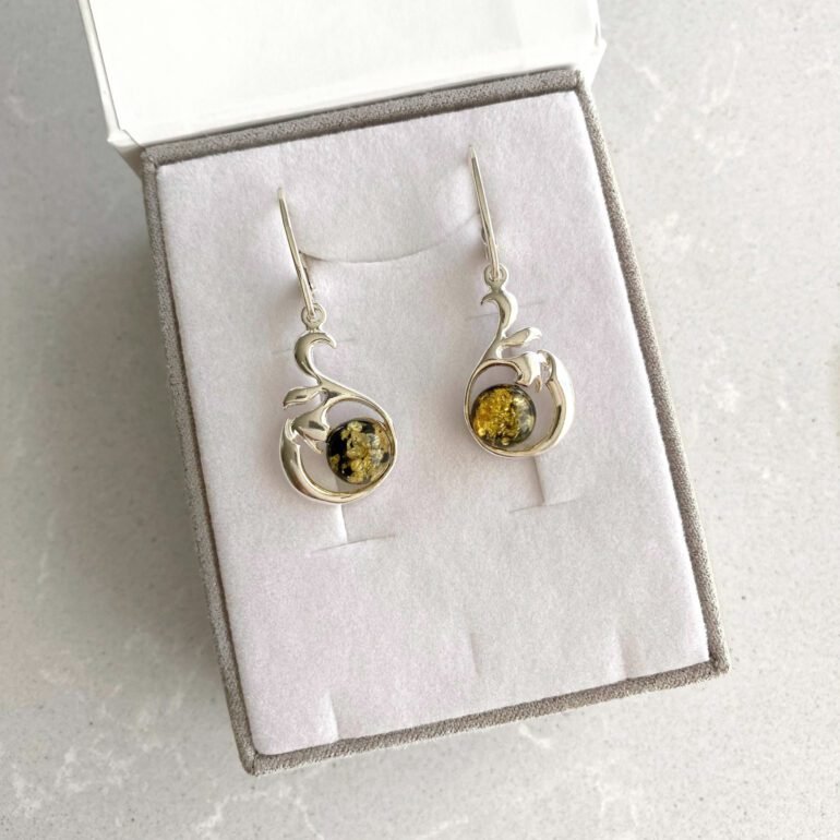 Sterling silver dandling earrings with green amber