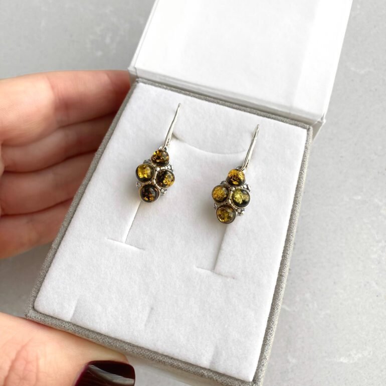 Sterling silver dandling earrings with green amber