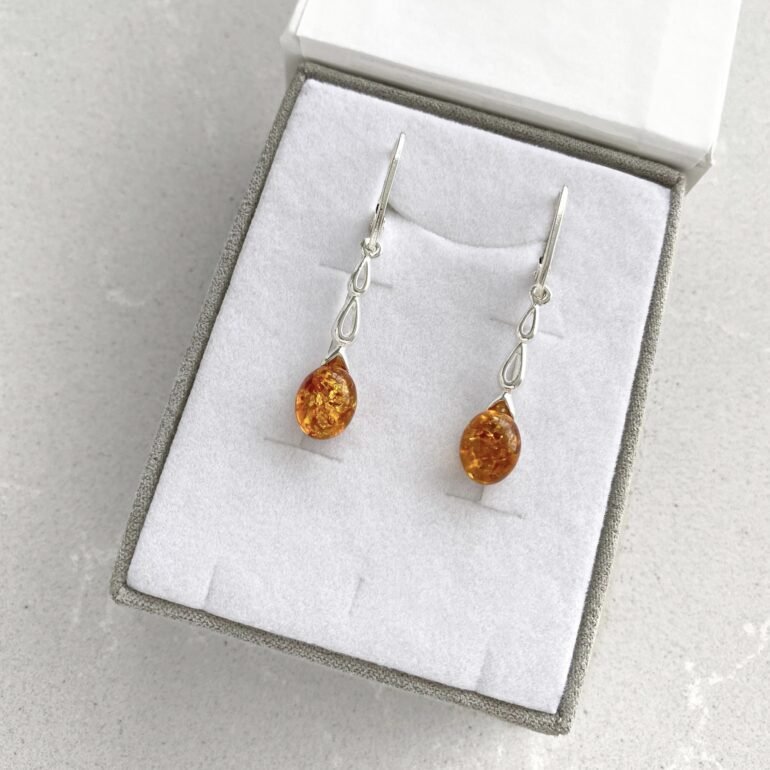 Sterling silver dandling earrings with amber