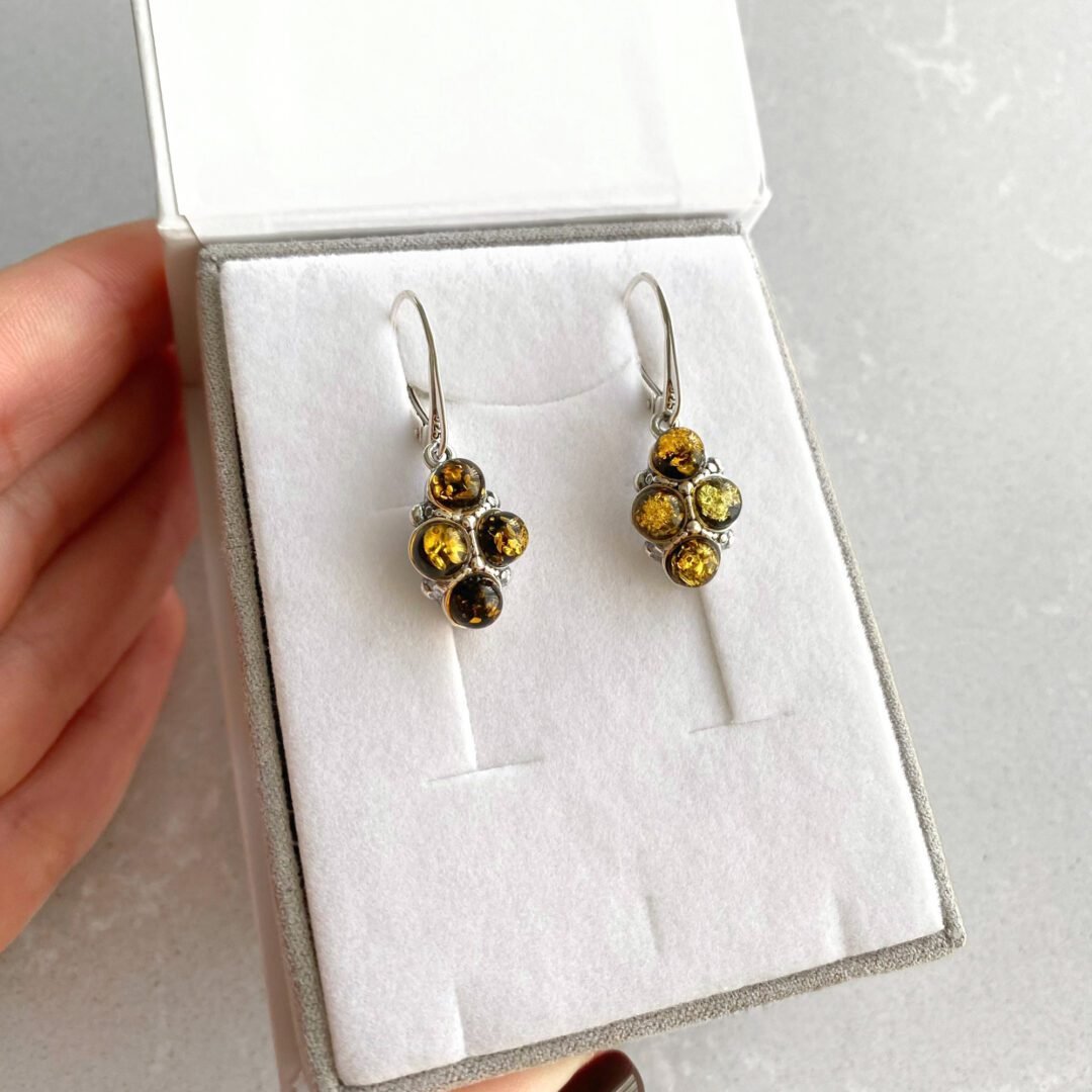 Sterling silver dandling earrings with green amber