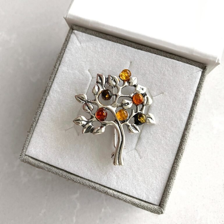 Sterling silver brooch with amber