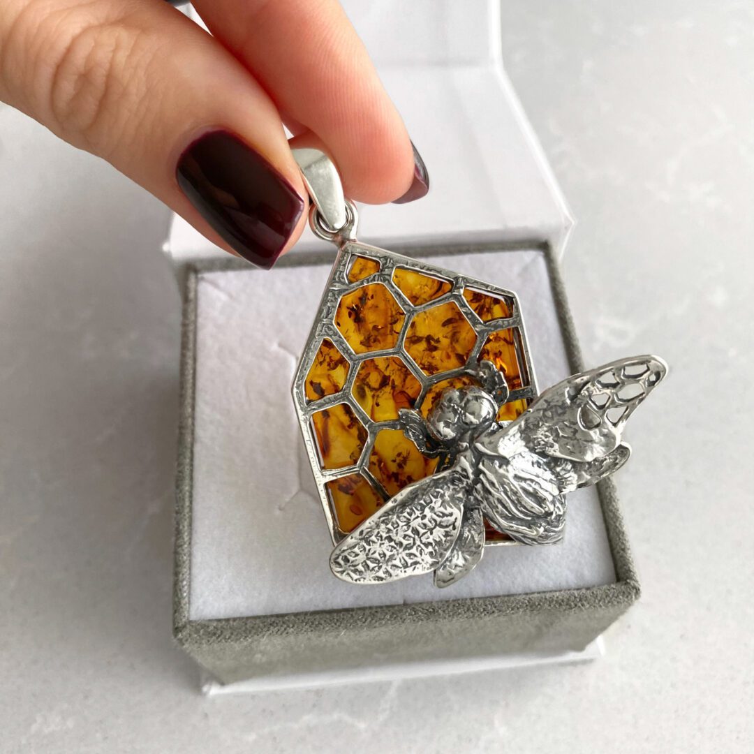 A massive sterling silver pendant with amber