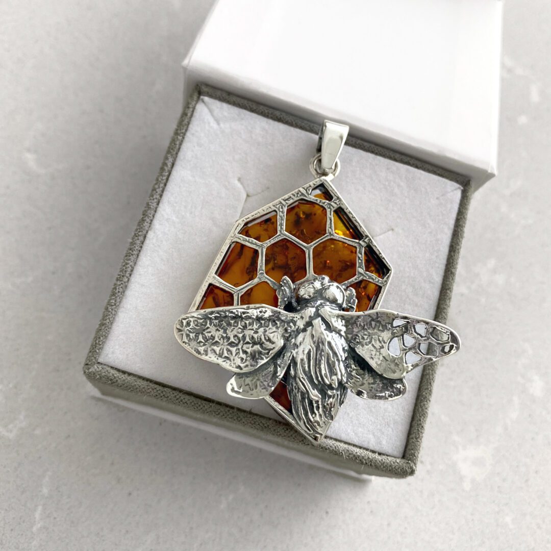 A massive sterling silver pendant with amber