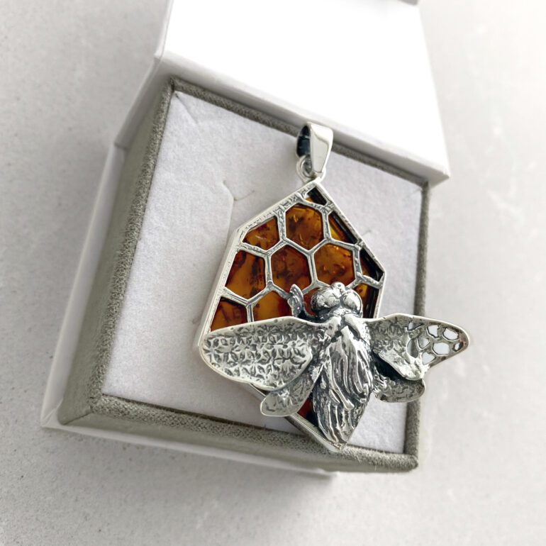 A massive sterling silver pendant with amber