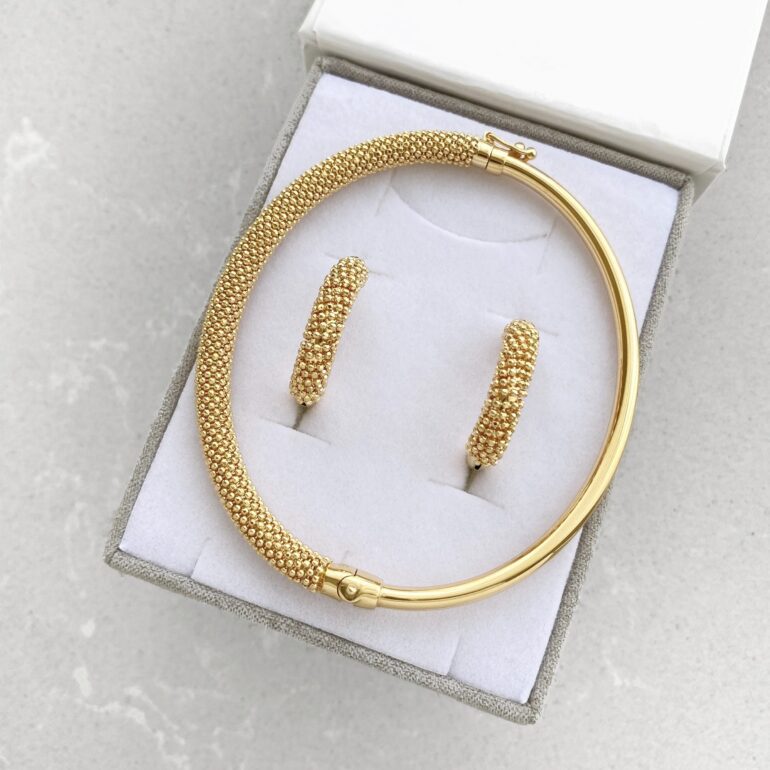 A modern yellow gold hoop earrings