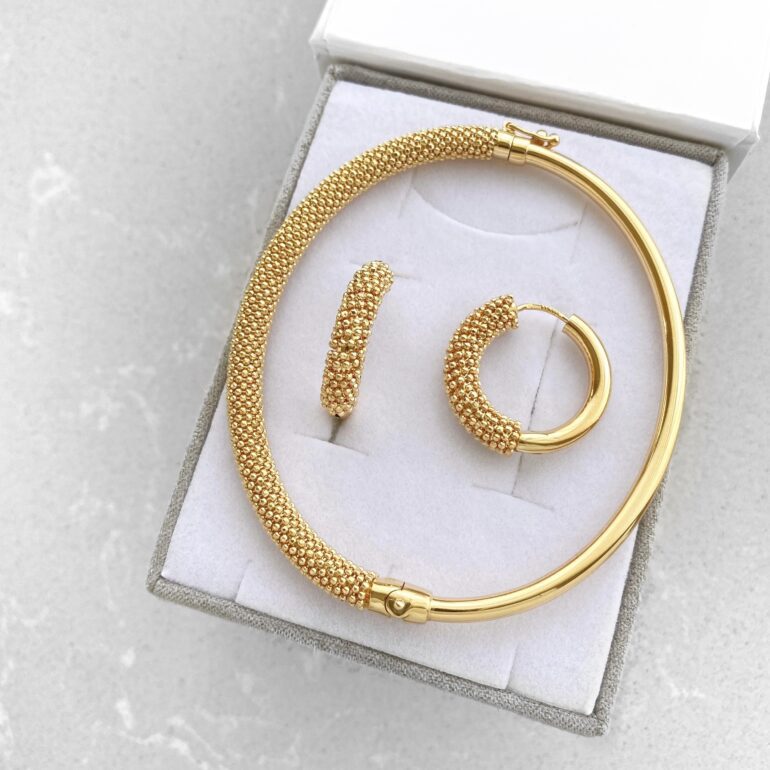 A modern yellow gold hoop earrings