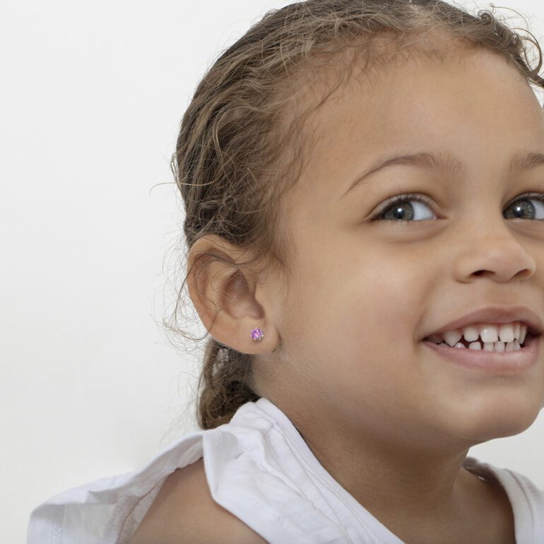 A pair of sterling silver stud kids earrings with cubic zirconia