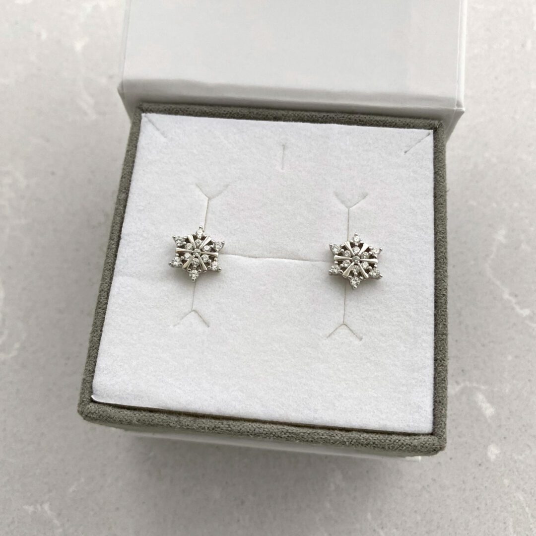 Sterling silver stud earrings with cubic zirconia - snowflakes