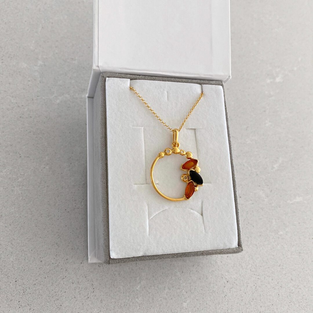 Yellow gold plated sterling silver chain with amber pendant