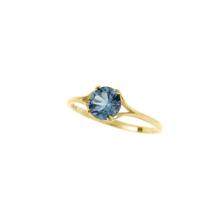 Yellow gold ring with London blue topaz