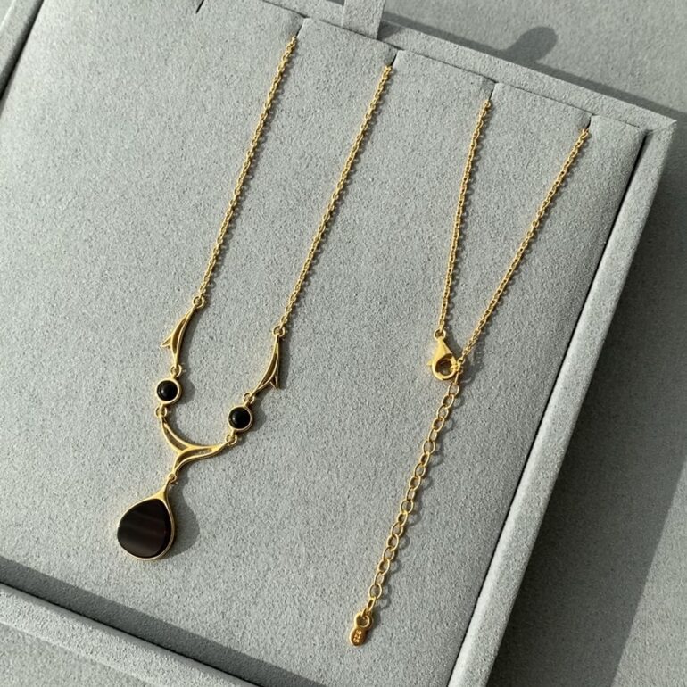 Yellow gold plated sterling silver necklace with amber