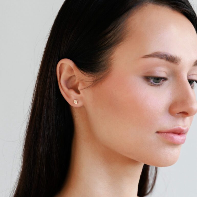 Rose gold engraved stud earrings with cubic zirconia