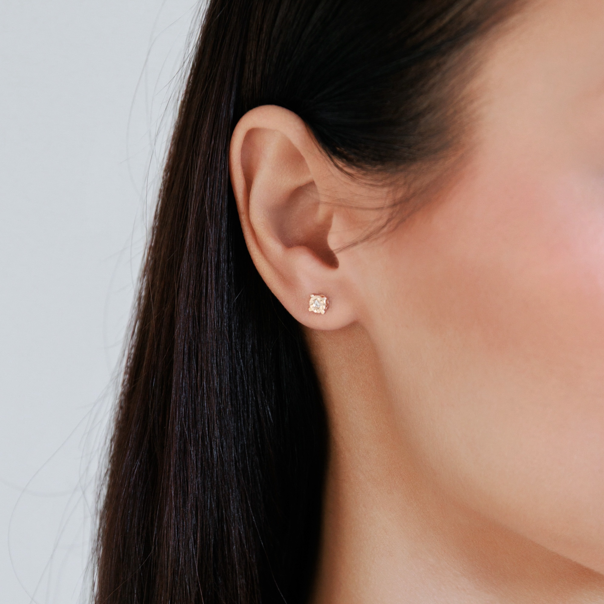 Rose gold engraved stud earrings with cubic zirconia