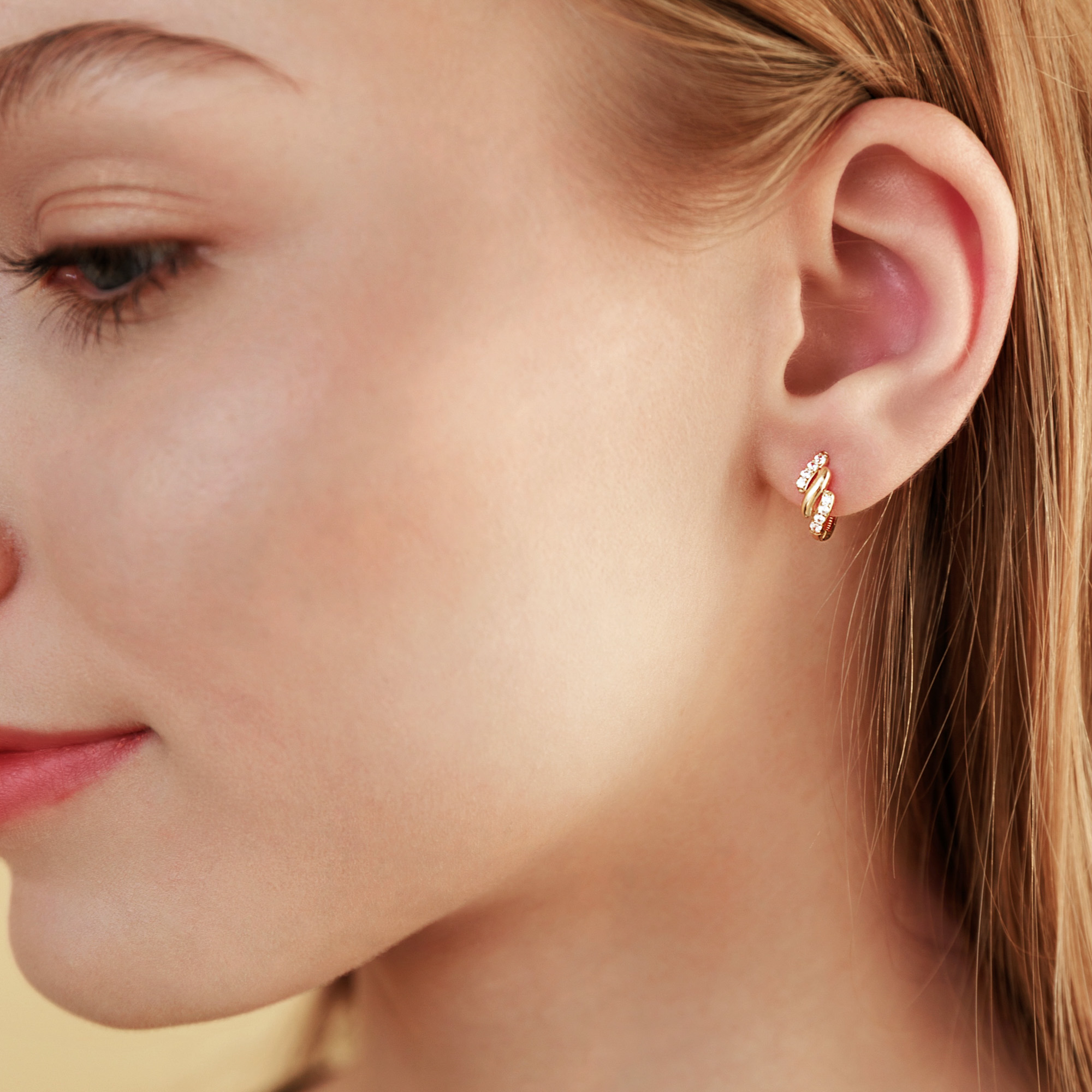 Yellow gold hoop earrings with cubic zirconia