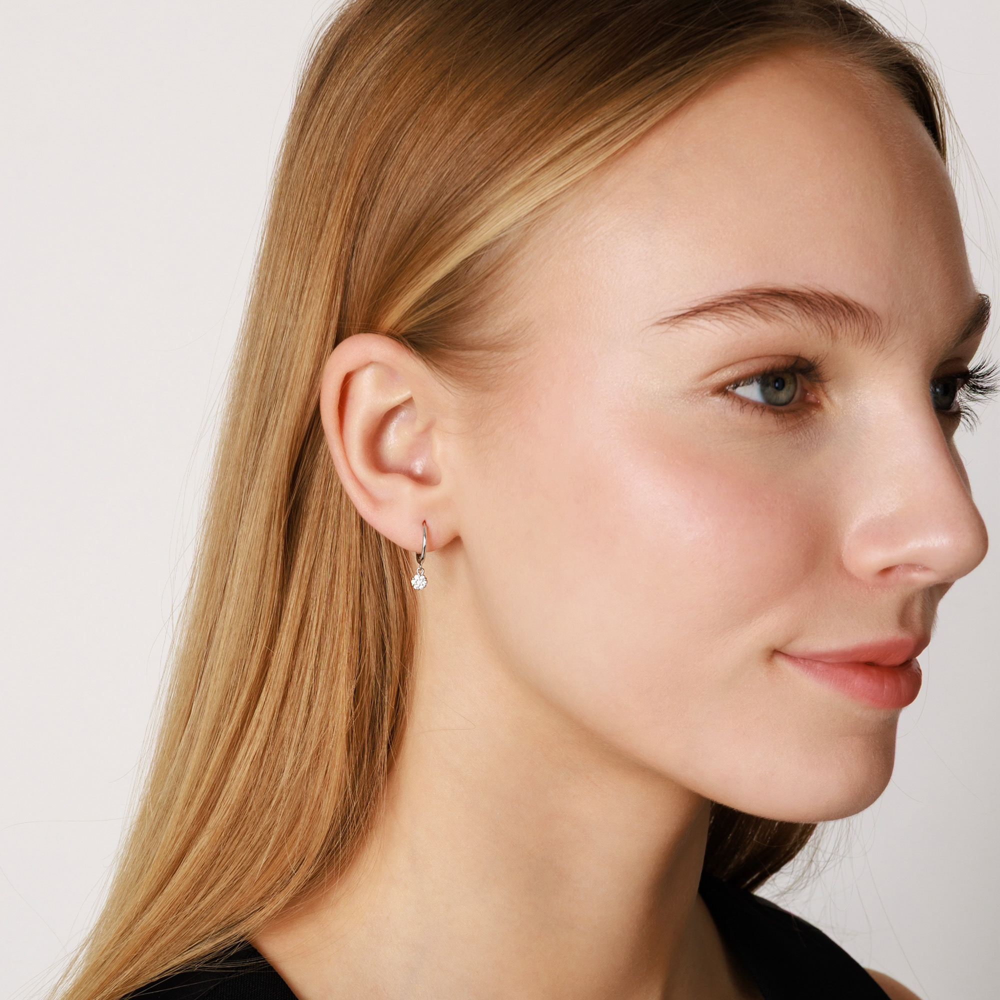 Sterling silver hoop earrings with dandling cubic zirconia