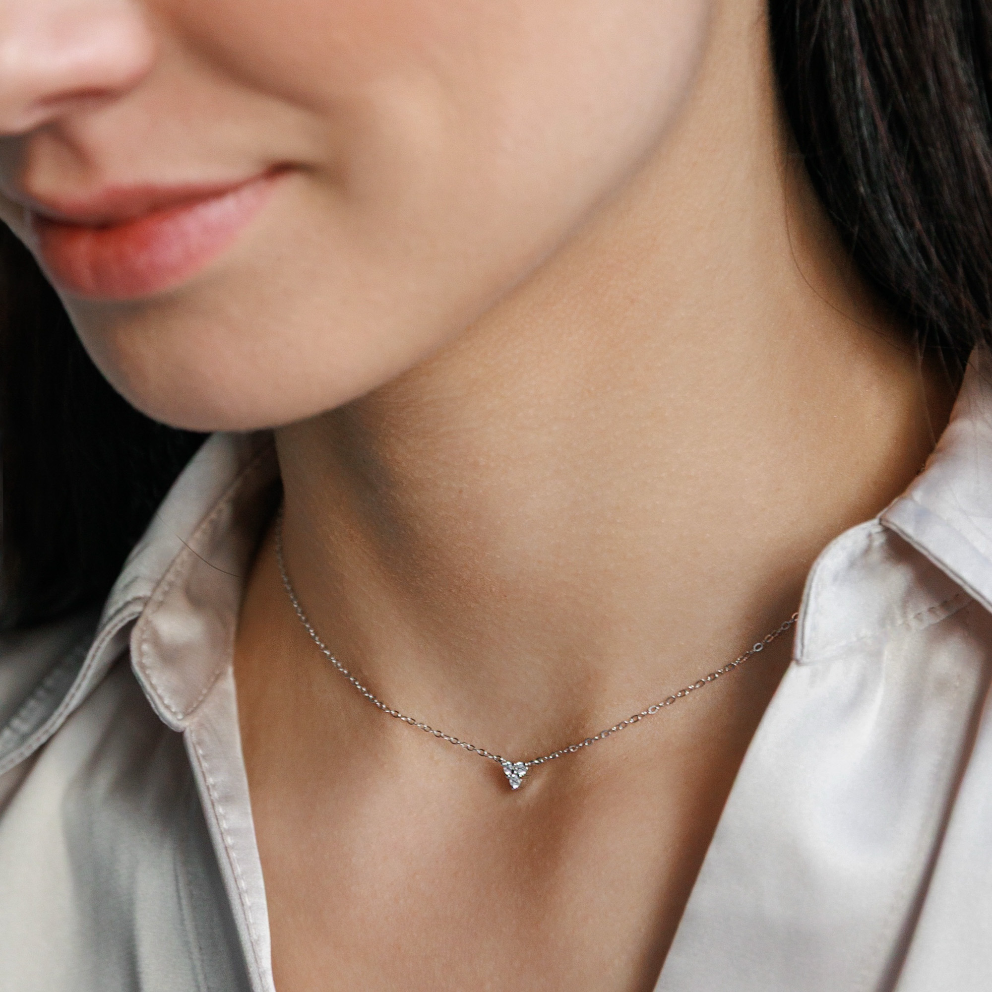 A minimalist sterling silver necklace with cubic zirconia